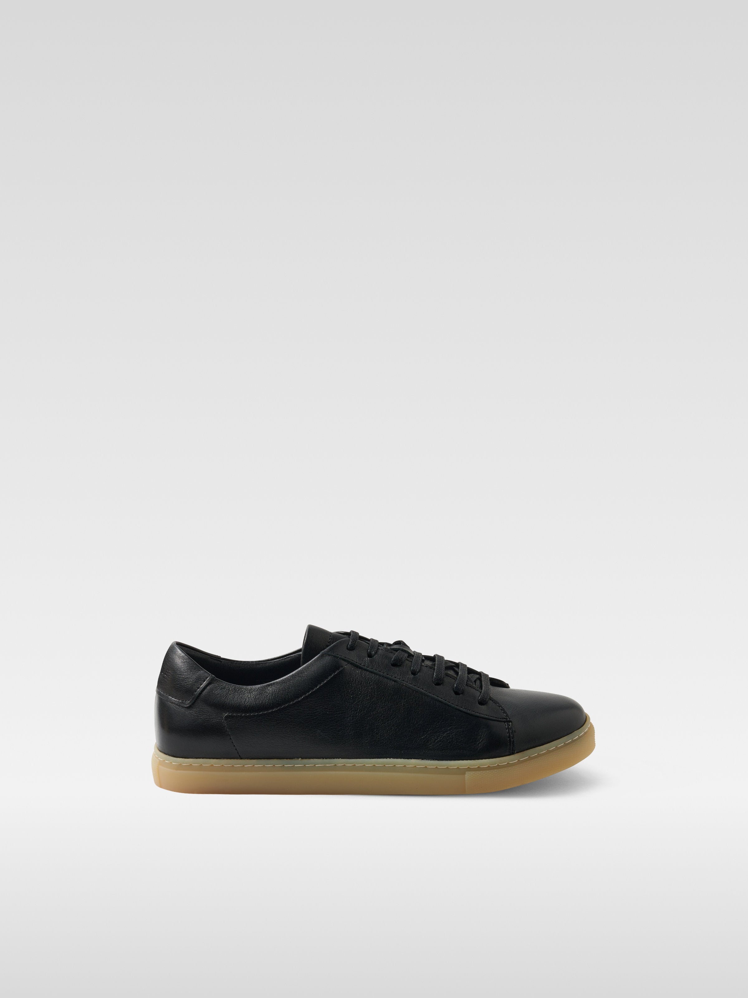 Black leather sneakers in gum sole for men