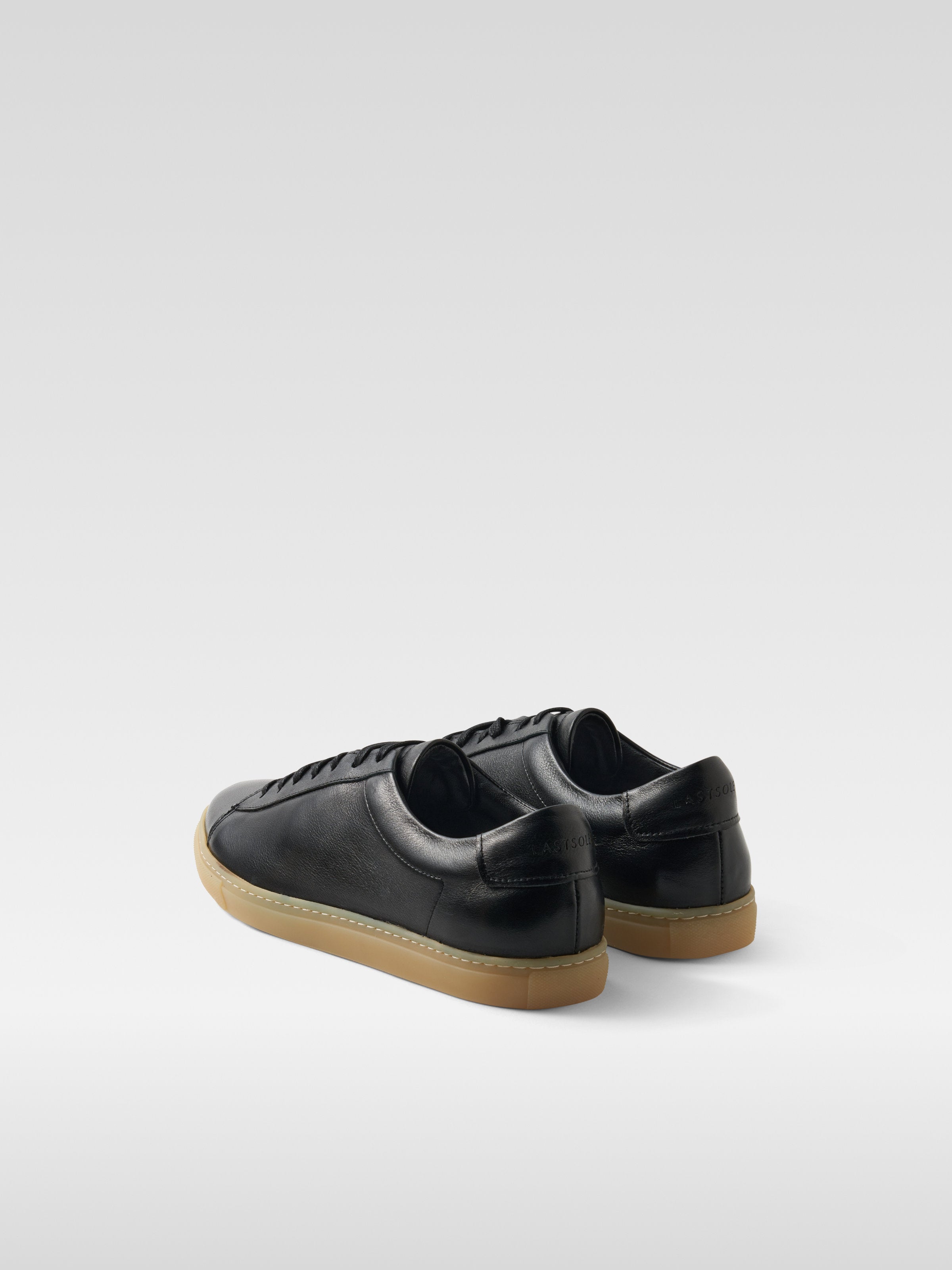 Black leather sneakers in gum sole for men