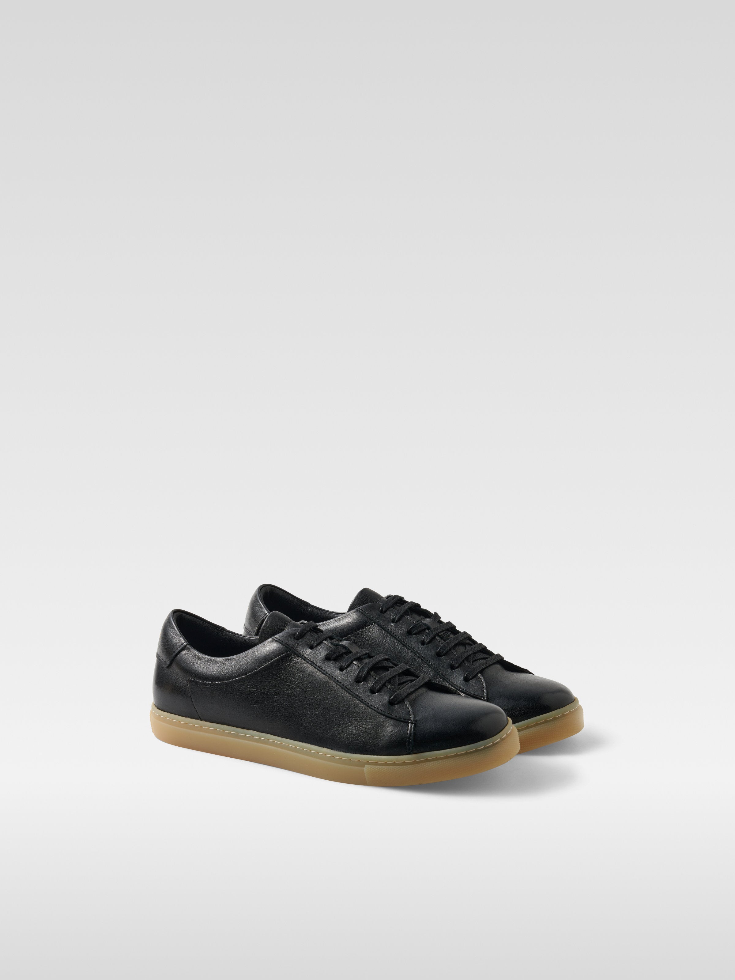 Black leather sneakers in gum sole for women