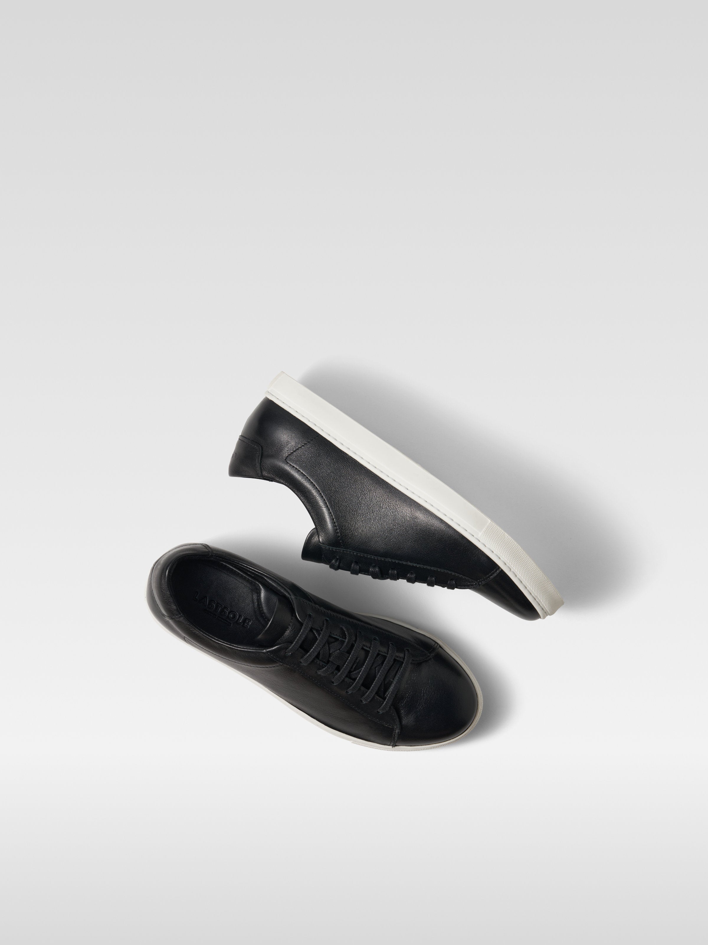 Black leather sneakers in white sole for men