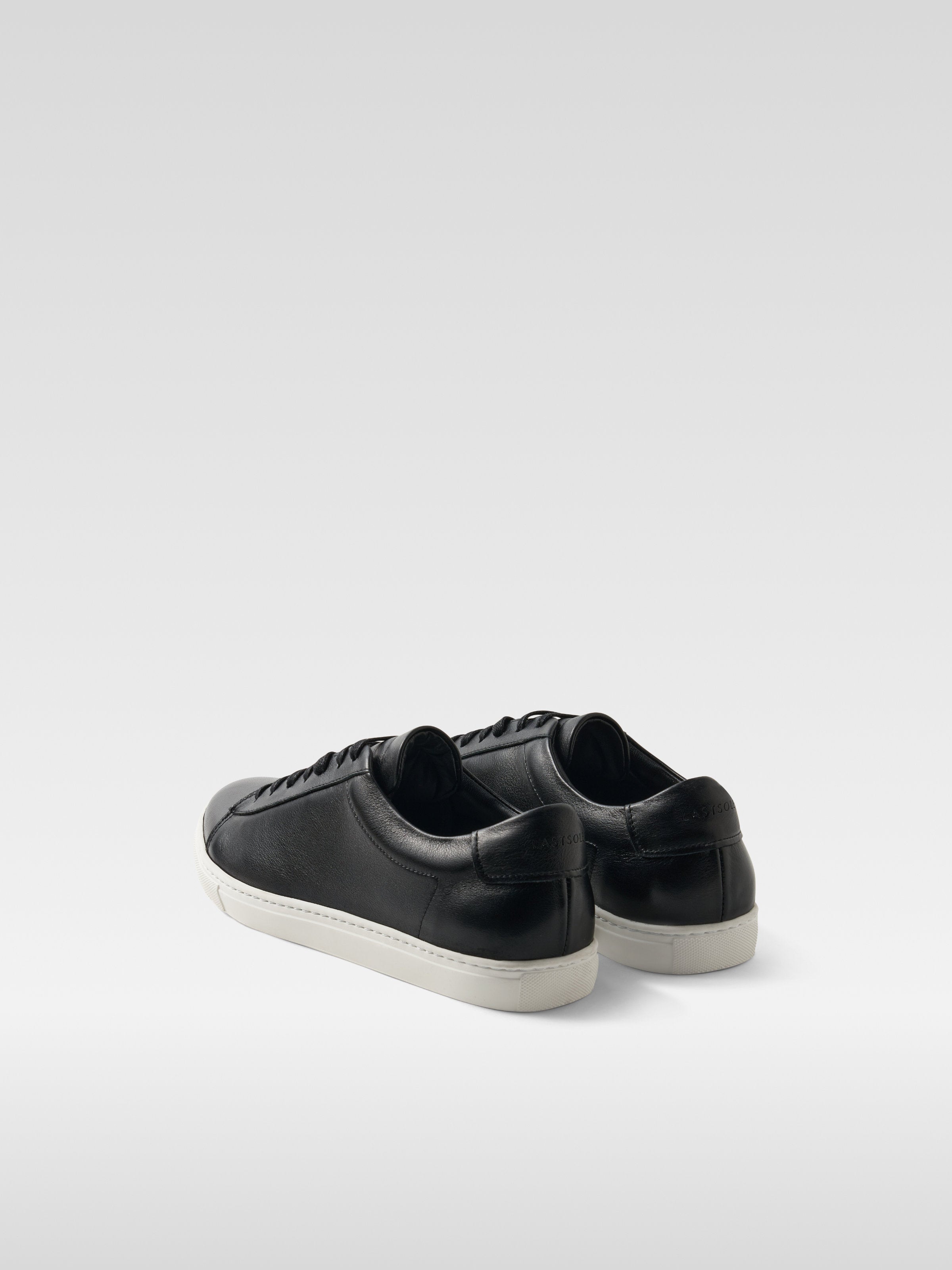 Black leather sneakers in white sole for men