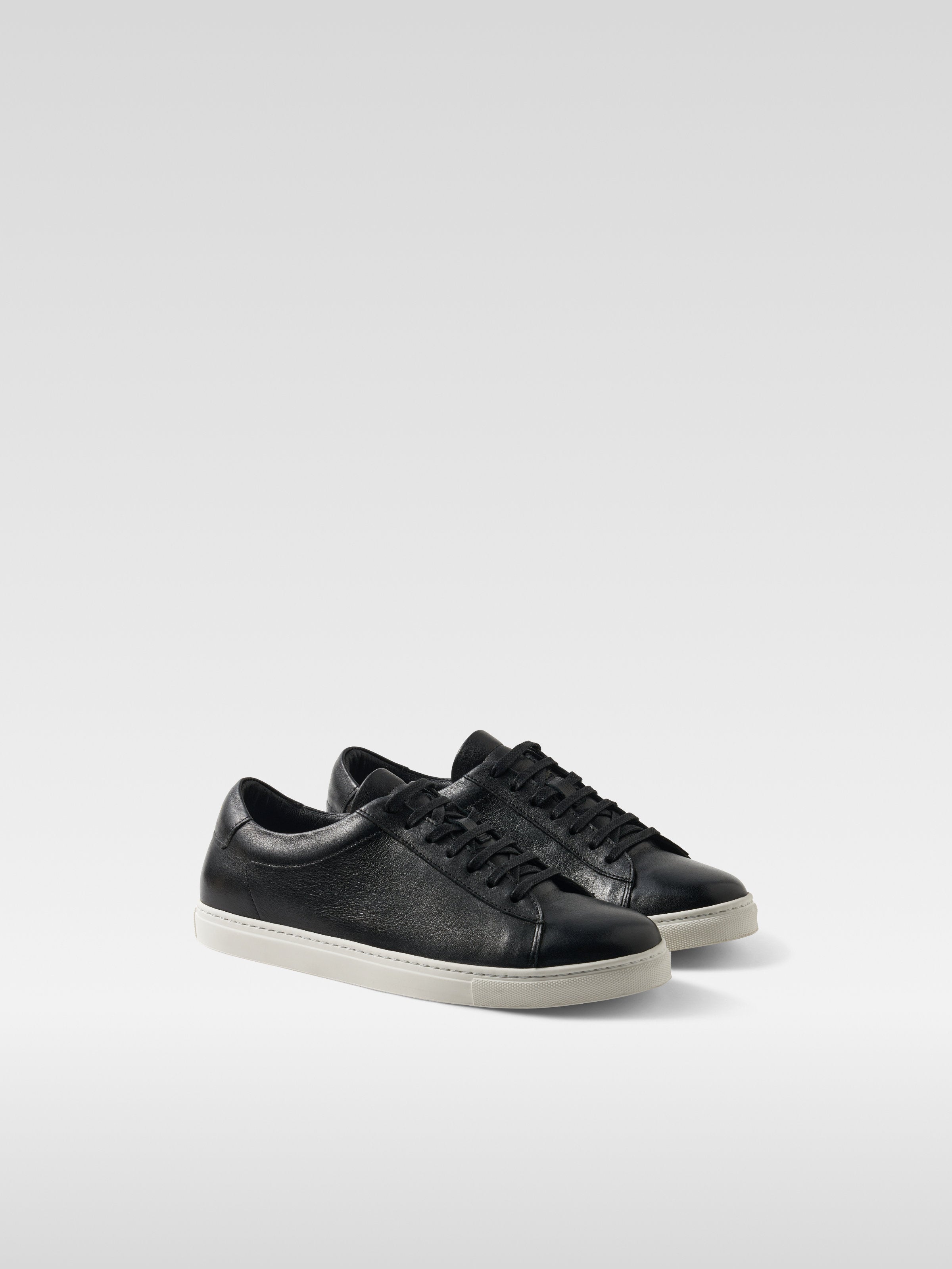Black leather sneakers in white sole for women