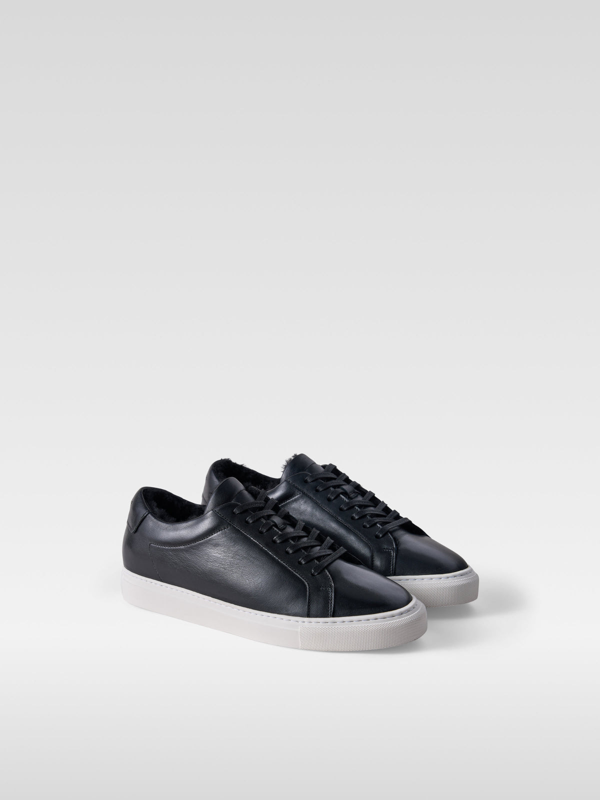 Metro black leather shearling-lined sneakers for men, three-quarter view