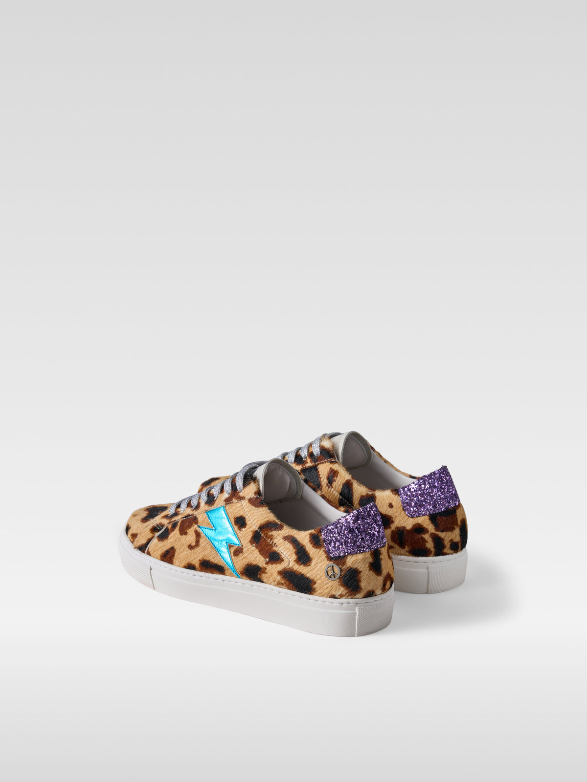 Pulse jaguar pony hair sneakers with turquoise lightning bolt for women, heel view