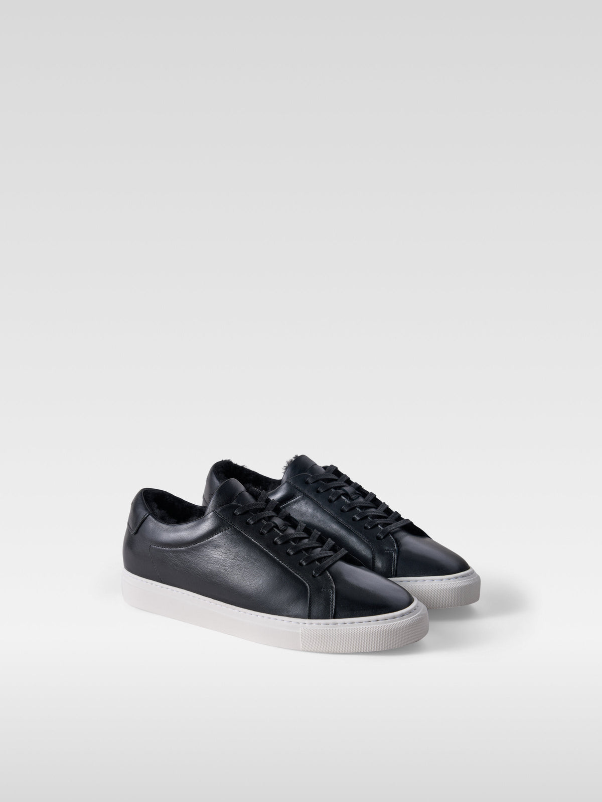 Metro black leather shearling-lined sneakers for women, three-quarter view