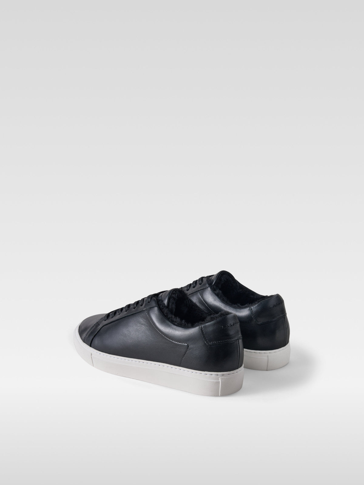 Metro black leather shearling-lined sneakers for women, heel view