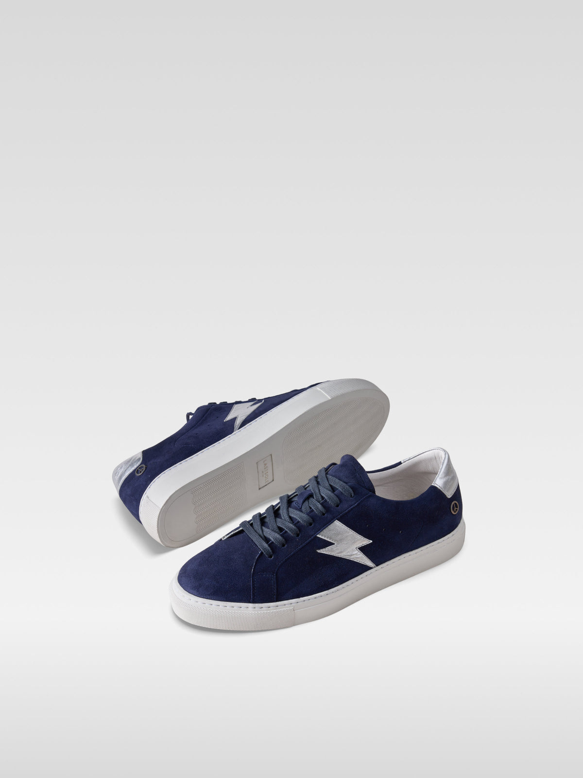 Pulse navy suede sneakers with silver lightning bolt for men, front view