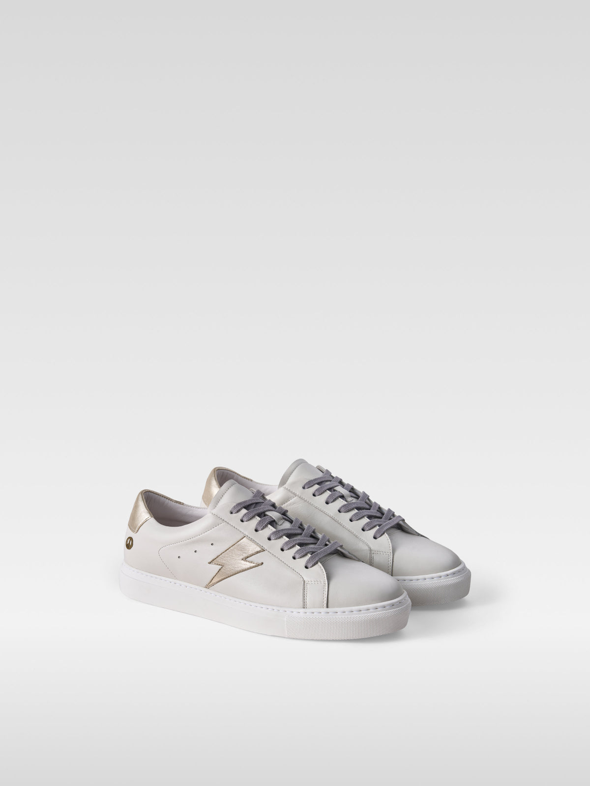 Pulse off white nappa sneakers with gold lightning bolt for men, three-quarter view