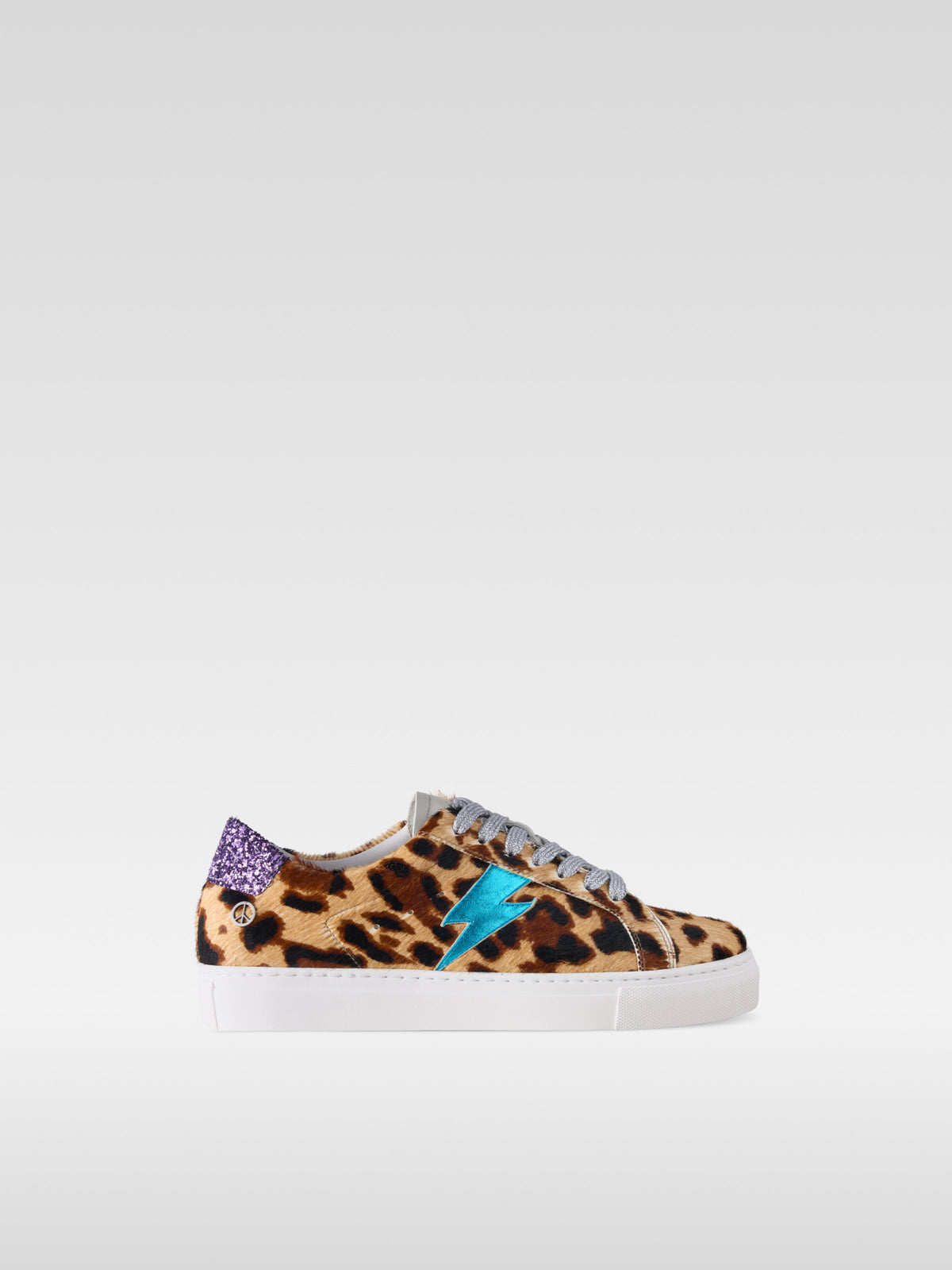 Pulse jaguar pony hair sneakers with turquoise lightning bolt for women, side view