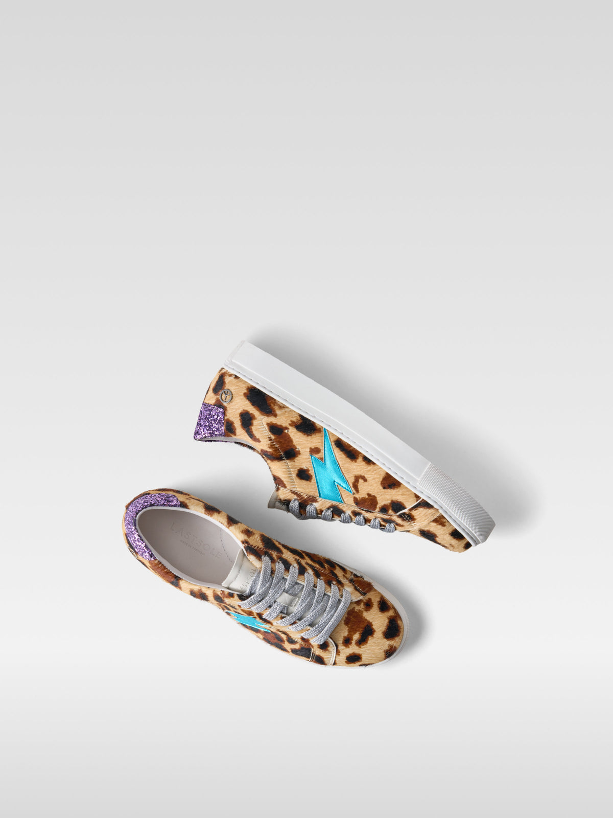 Pulse jaguar pony hair sneakers with turquoise lightning bolt for women