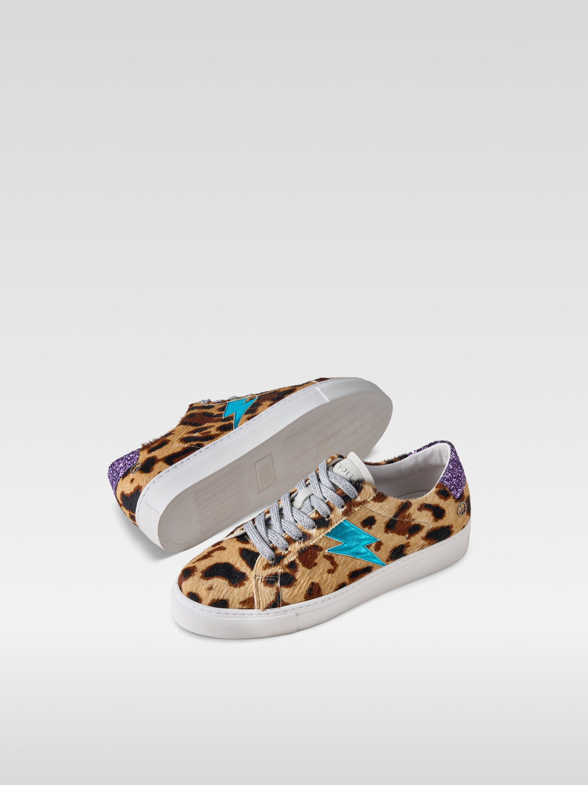 Pulse jaguar pony hair sneakers with turquoise lightning bolt for women, front view